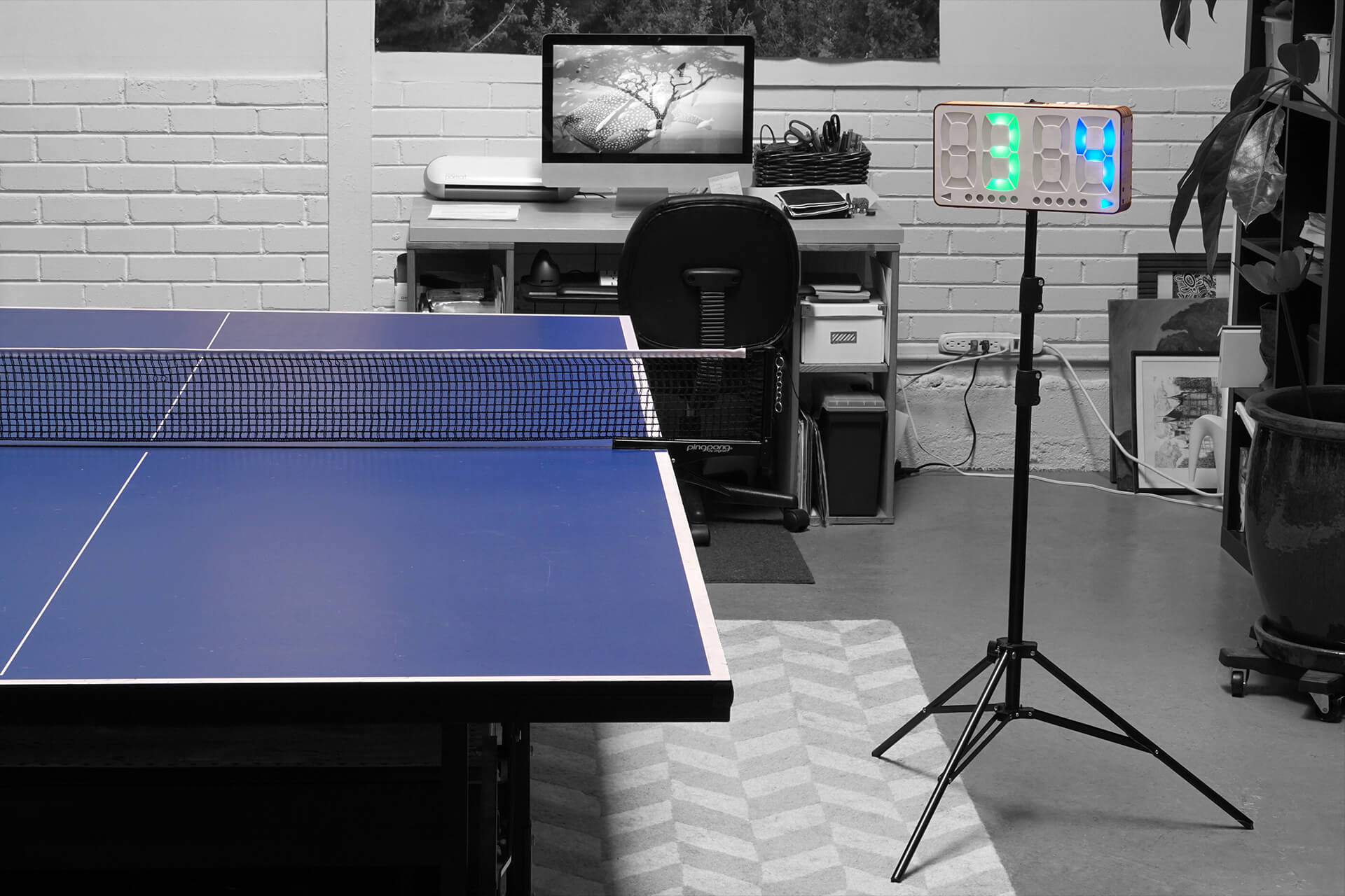 Showing the table tennis scoreboard on a tripod.