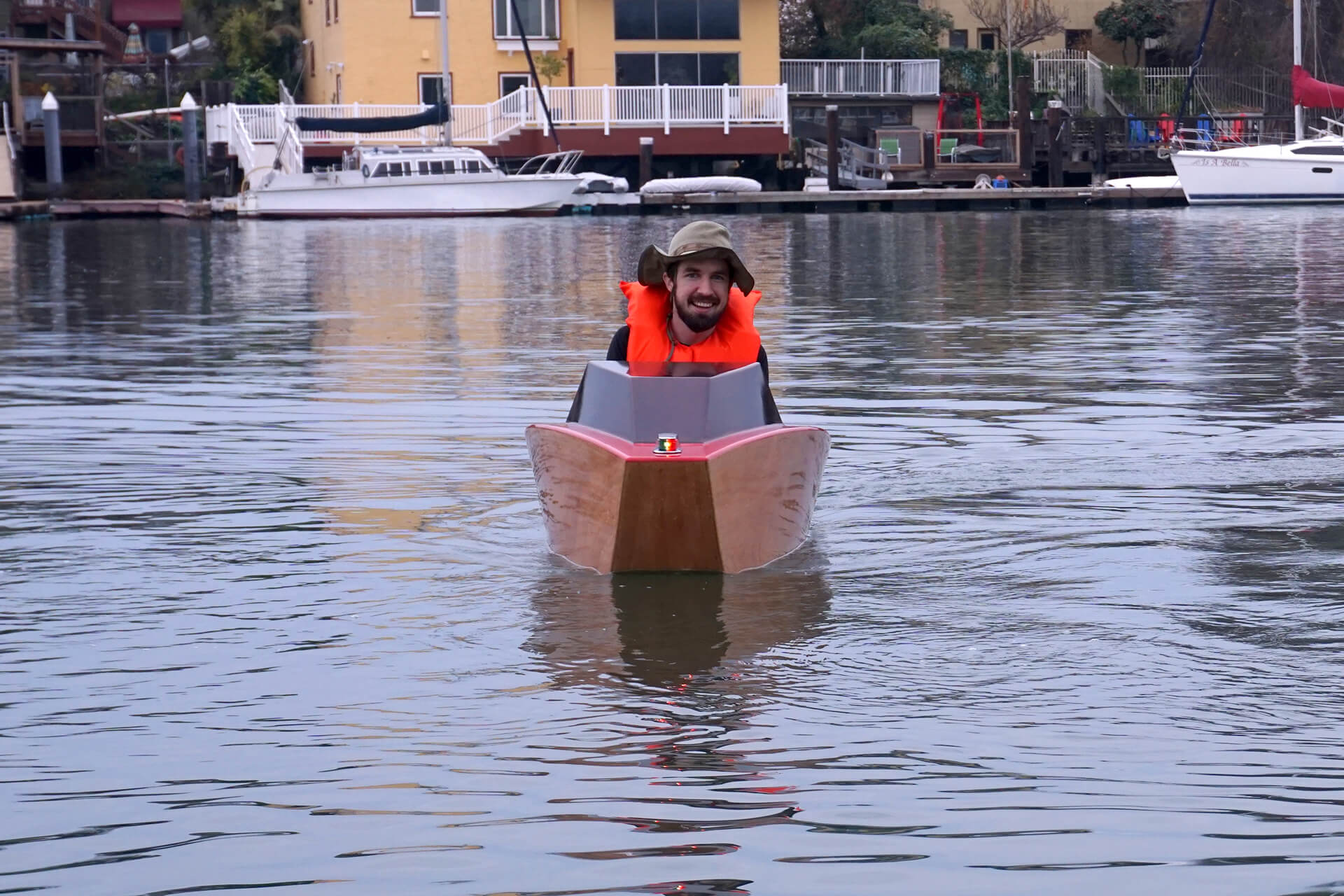 Josh racing towards the camera at the first launch of the mini electric boat.