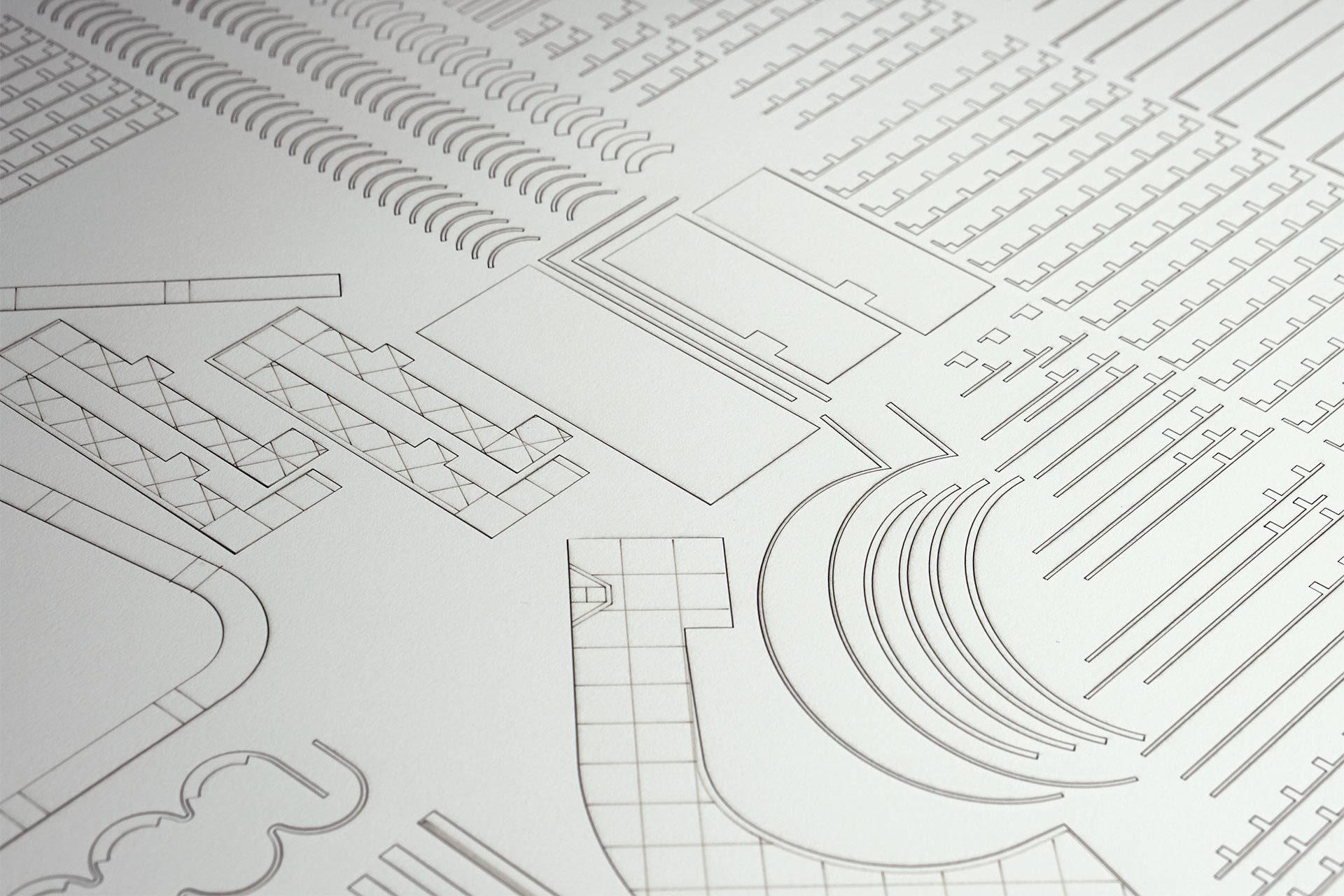 A close up shot of a laser etched and cut sheet of paper.