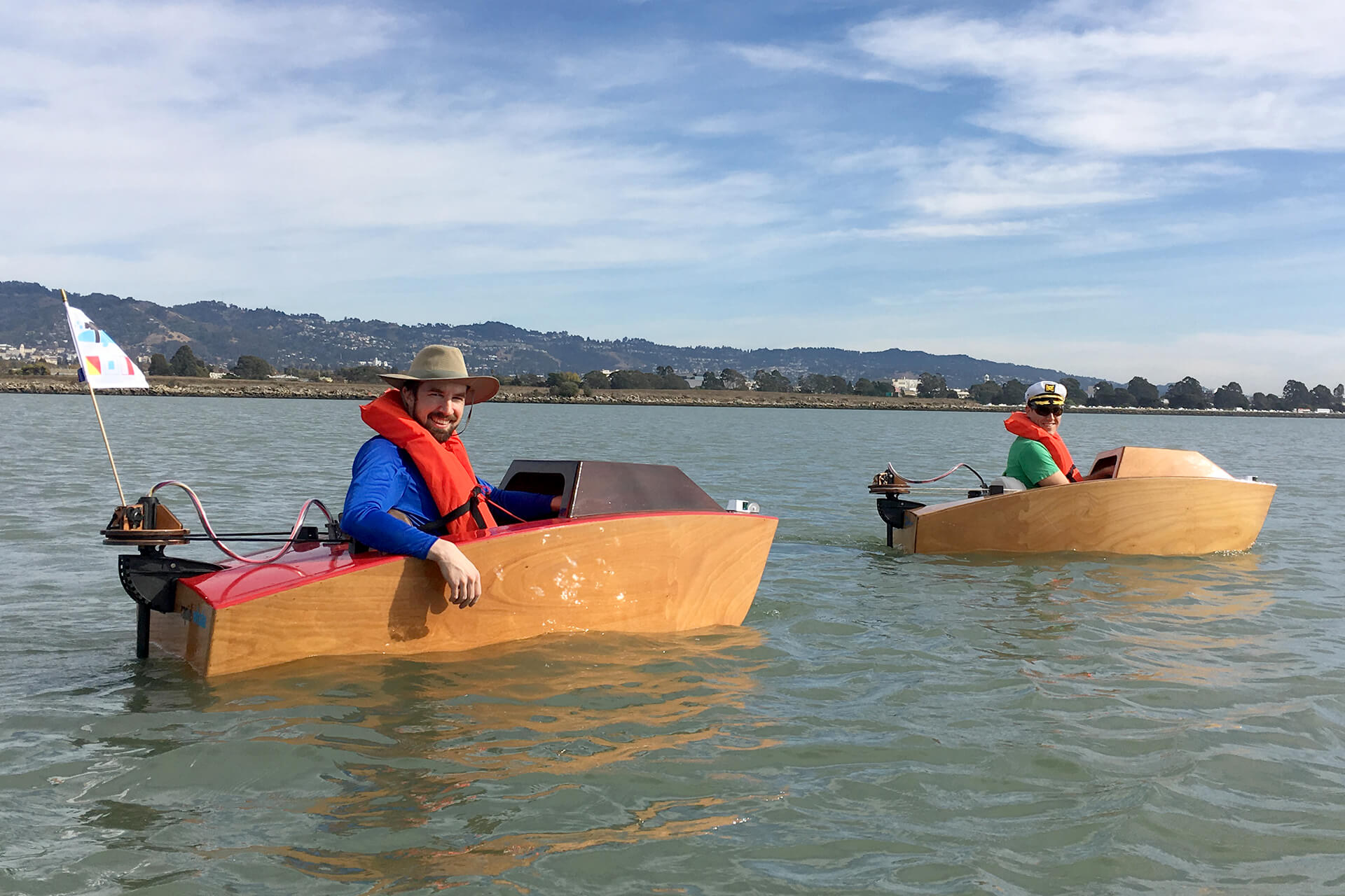 Josh and Dylan in their mini boats in Berkeley.