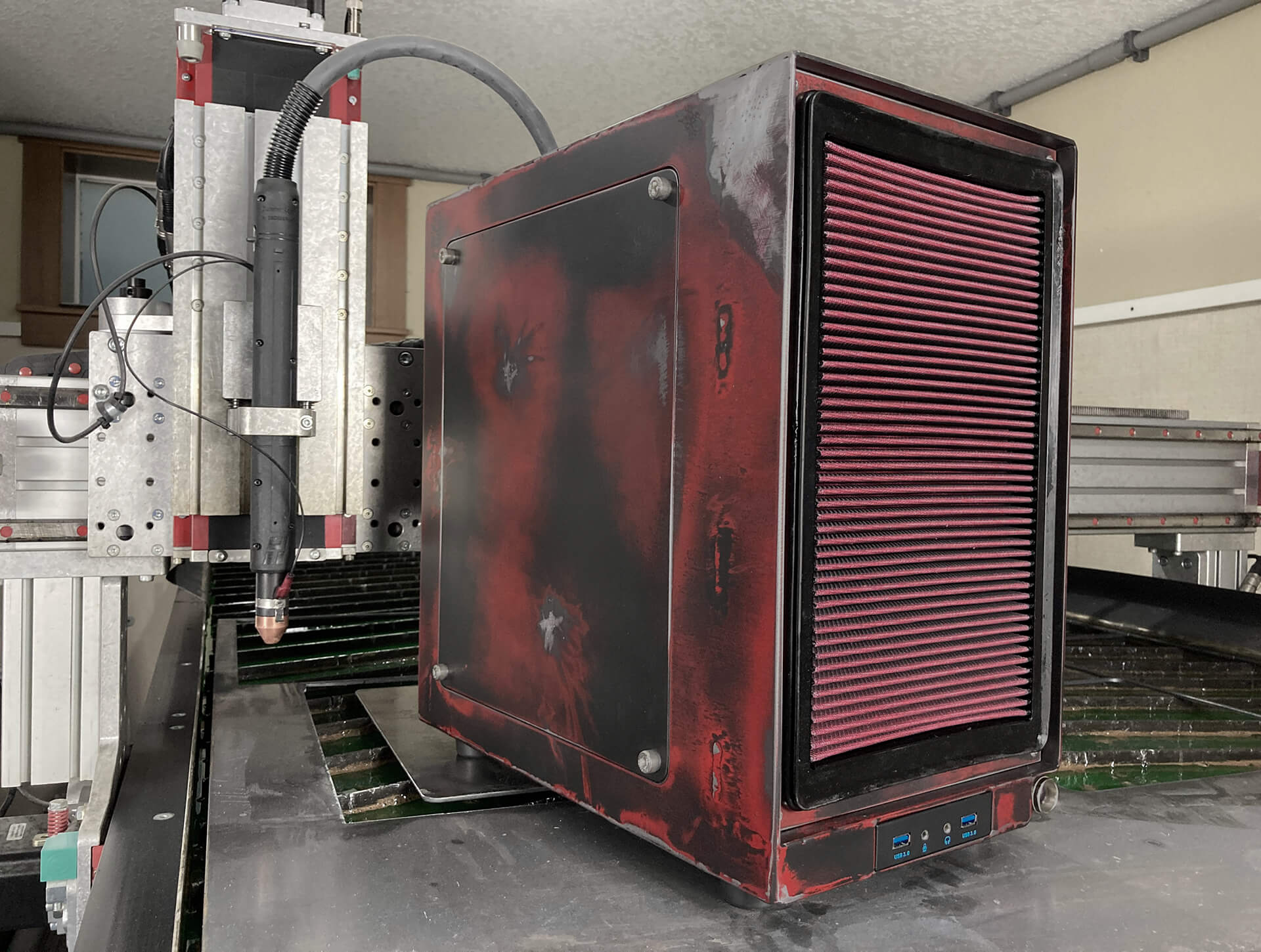 The PC sitting on top of the plasma cutter.