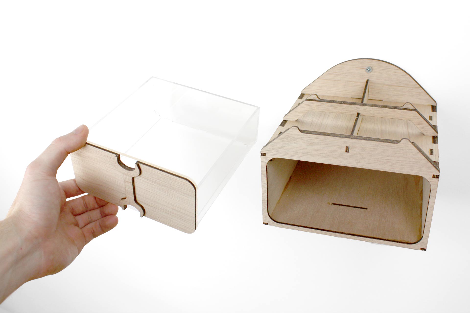 A hand removing the built-in tool drawer from the RC Wall Mount.